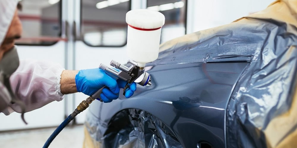 Image Of Car's Body Being Painted Black